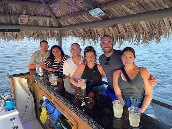 frinds celebrate aboard Nautical Tiki Cruises